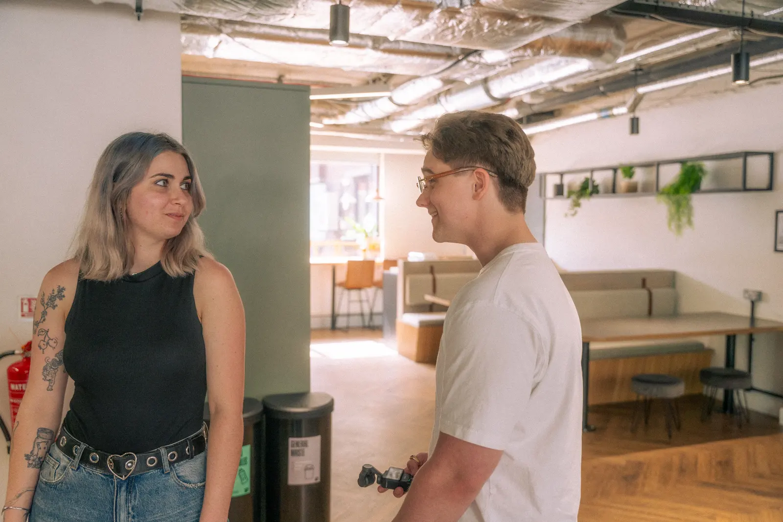 Exposure Marketing team talking in the office lounge.